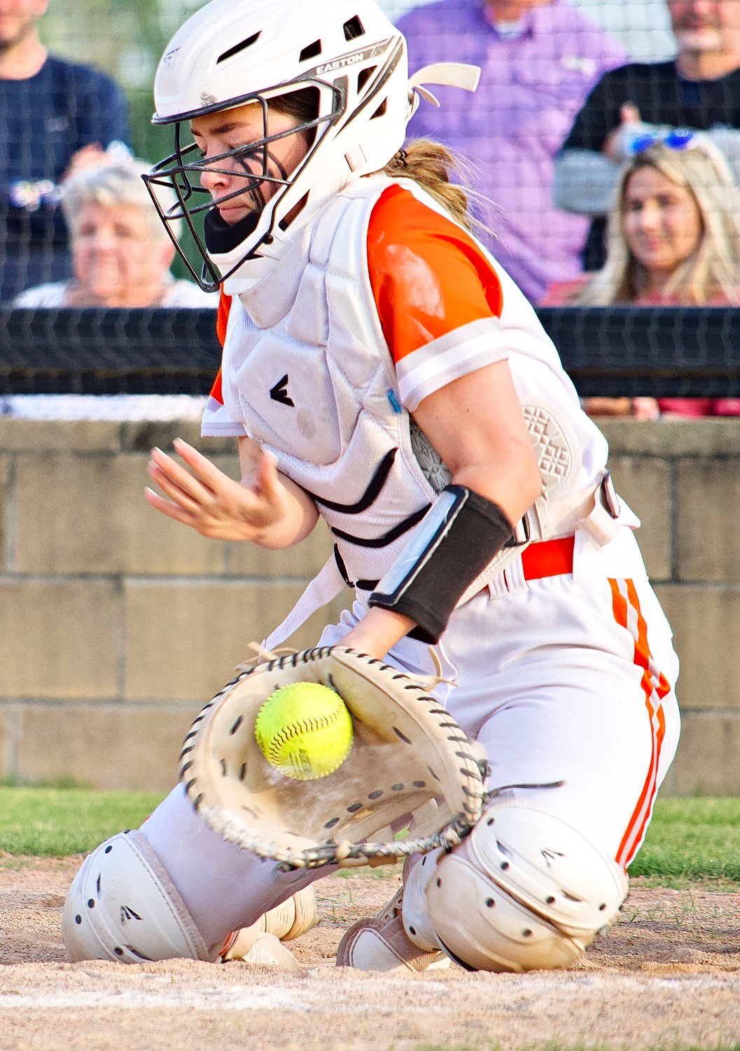 A wall behind home plate, Jaycee Smith rarely lets balls by her and has a knack for gunning down runners. [more fields of view]